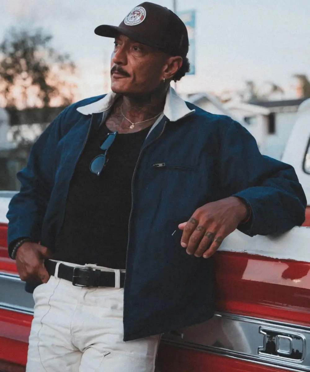 Jesse Ryan standing on a car